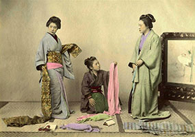 Old photo Japan puttin on a kimono